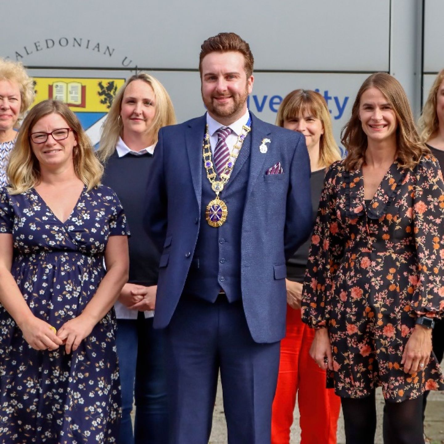 An image of Ross McGhee, a GCU alumnus and President of the Society of Radiographers 2022/23, photographed with colleagues.