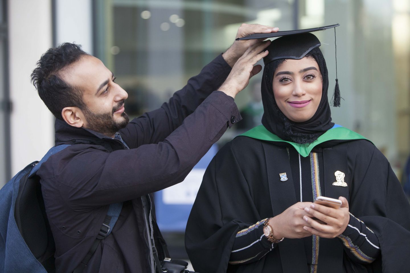 A student celebrates on graduation day at Glasgow Caledonian University.