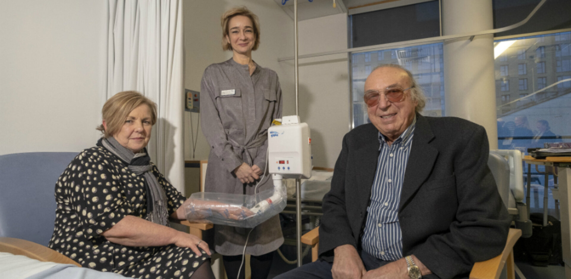 A 'patient' demonstrates the airglove with SHLS Vice Dean Professor Anita Simmers and Gio Benedetti.