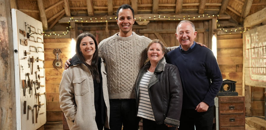 Fiona McDonald, Will Kirk, Kate McDonald and Bill McDonald with the restored desk in the Repair Shop