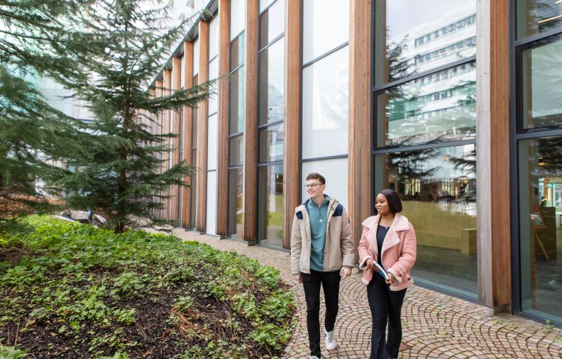 two students in campus garden