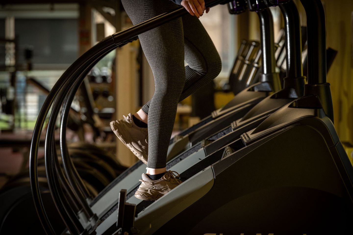 A person using a StairMaster exercise machine, in the ARC Gym on GCU's Glasgow campus.