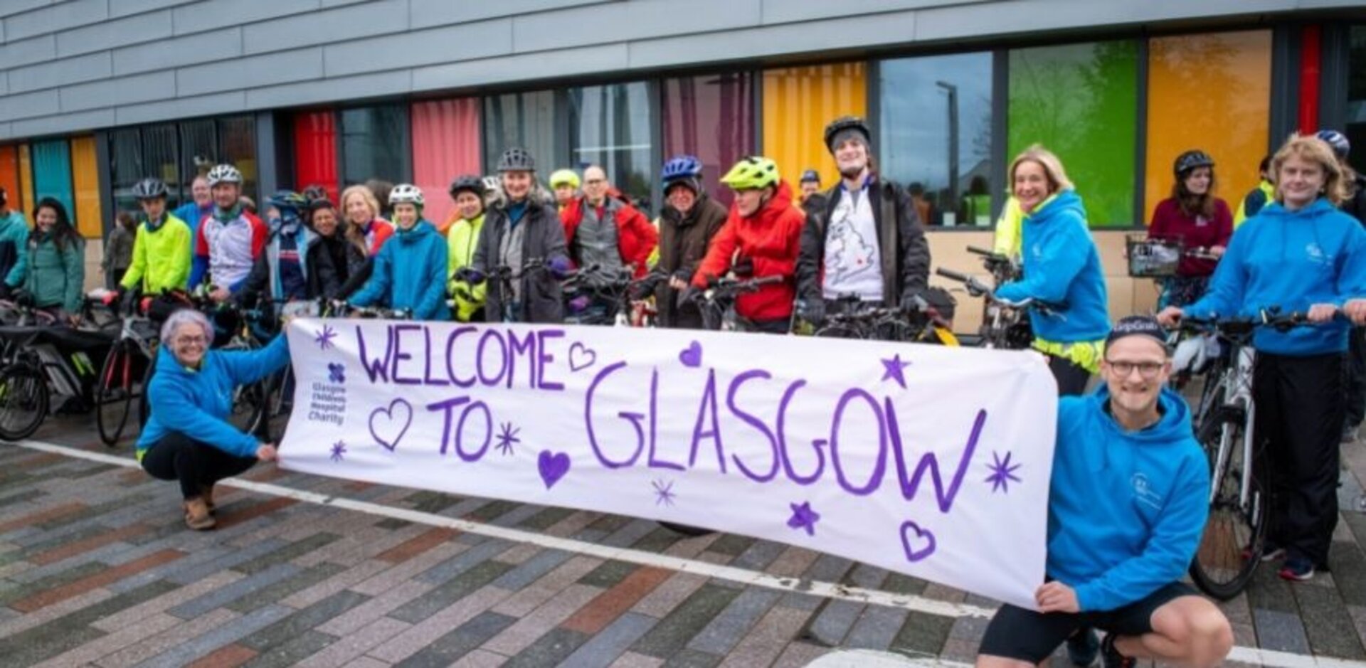 Megan helped hold the sign to welcome doctors to Glasgow after their monumental effort