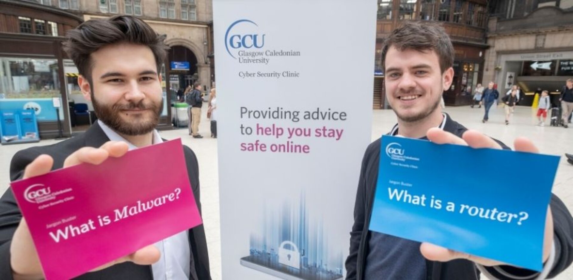 (Pictured above) Student volunteers working at the Cyber Clinic in Glasgow Central station