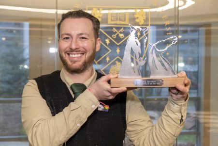 GCU Alumnus and GCU Alumni of the Year (AOTY) winner Craig Davidson holding his AOTY award