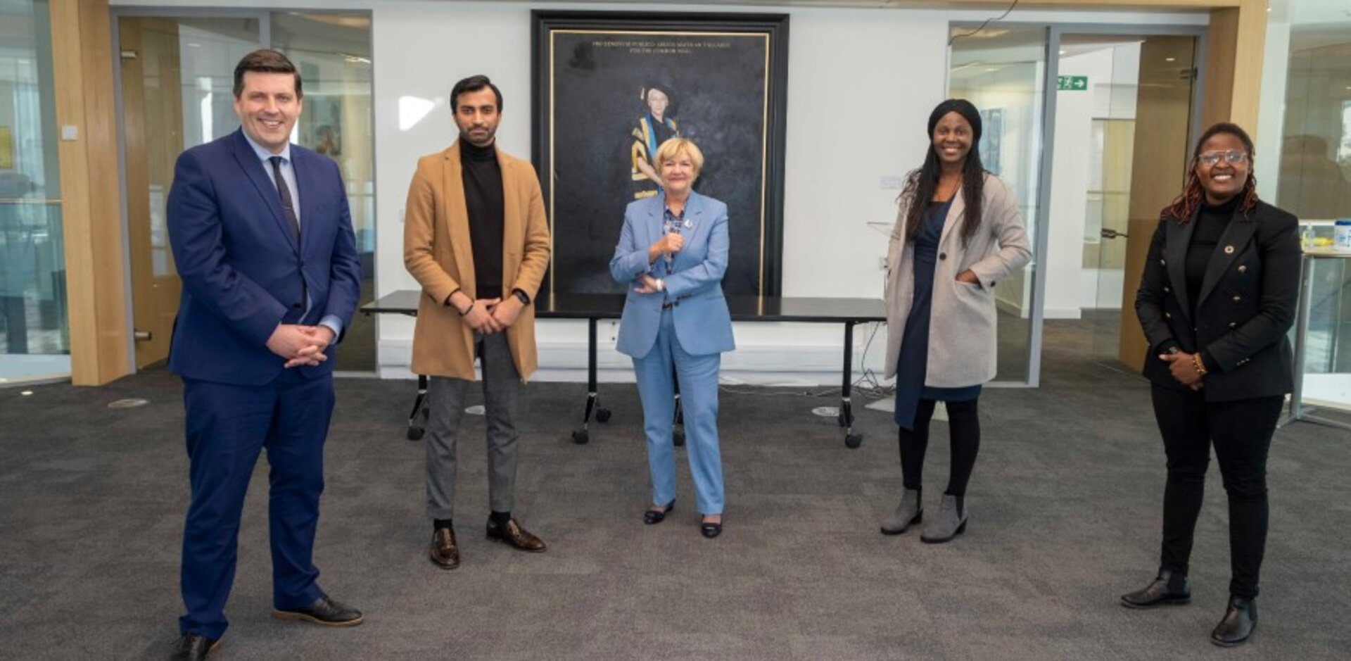 Jamie Hepburn with Professor Gillies and Adil Rahoo, Tabitha Nyariki, and Priscilla Opeyemi Otuagoma.